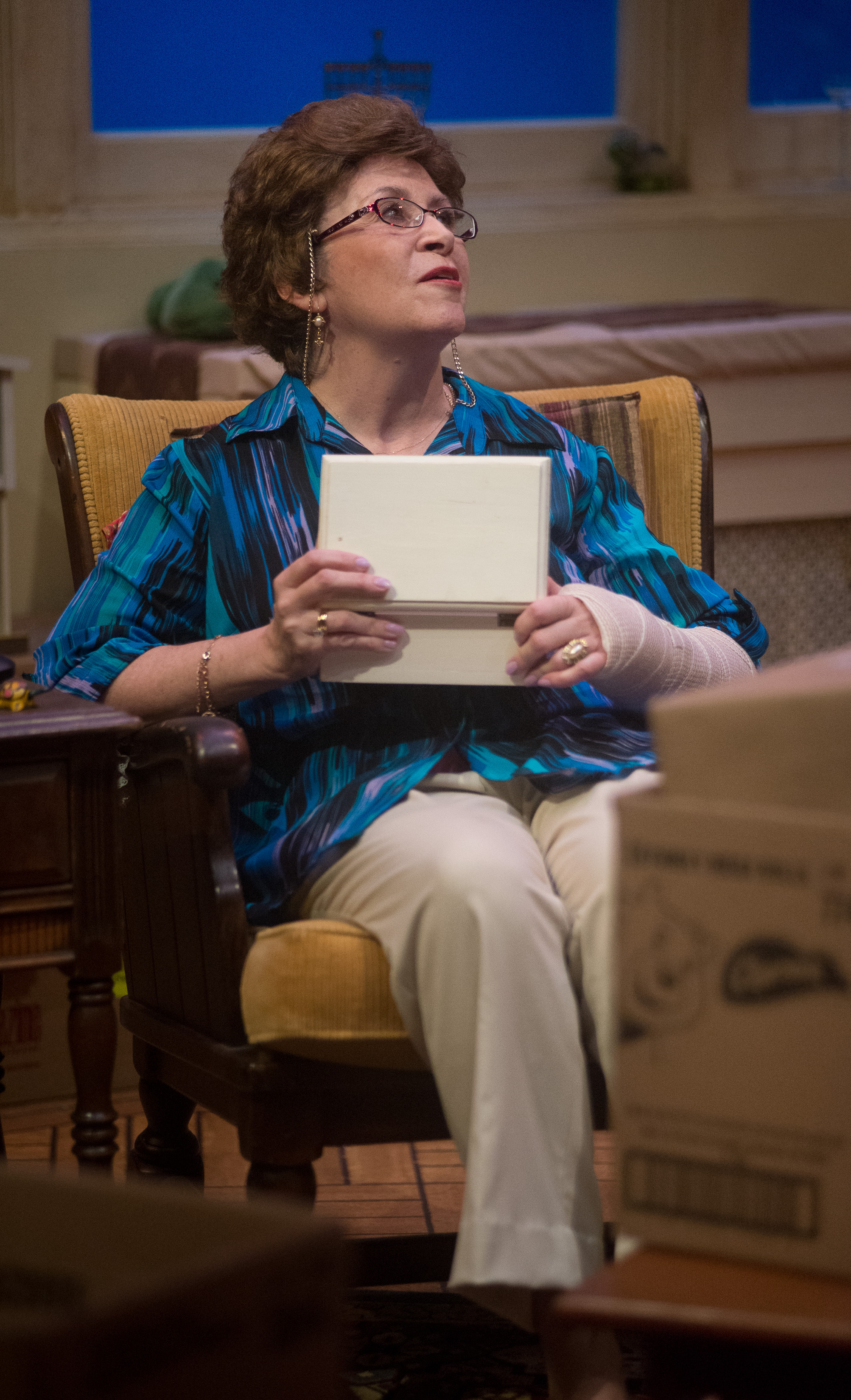 Maura O'Brien holds a music box to her chest remembering a childhood lullabye. photo courtesy of Robert Eddy